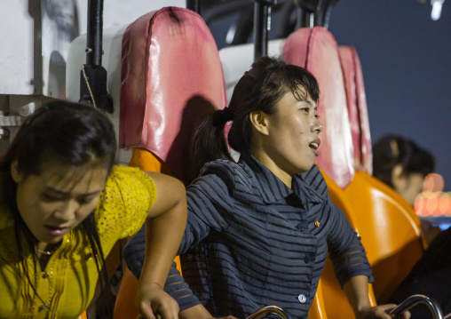 People with nausea coming down from a roller coaster in Kaeson youth park, DGC, Pyongyang, North Korea