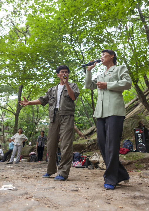 North Korean electricity company workers singing in a park, North Hwanghae, Kaesong, North Korea