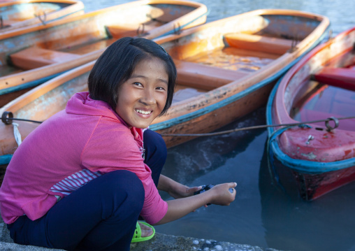 Girl washing her clothes in Songdowon international children's camp, Kangwon Province, Wonsan, North Korea