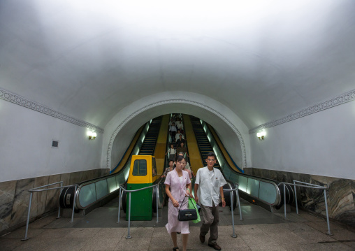 North Korean people using escalator leading to the subway station, DGC, Pyongyang, North Korea