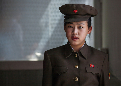 North Korean young female guard in central history museum, DGC, Pyongyang, North Korea