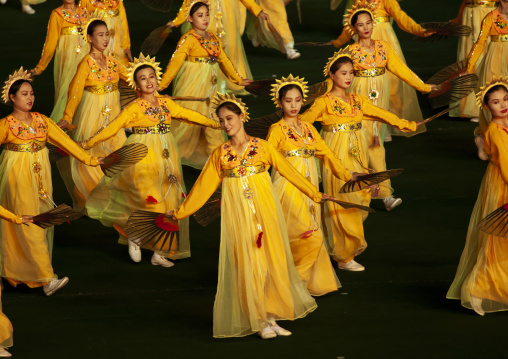 Women dancing in choson-ot during the Arirang mass games, DGC, Pyongyang, North Korea