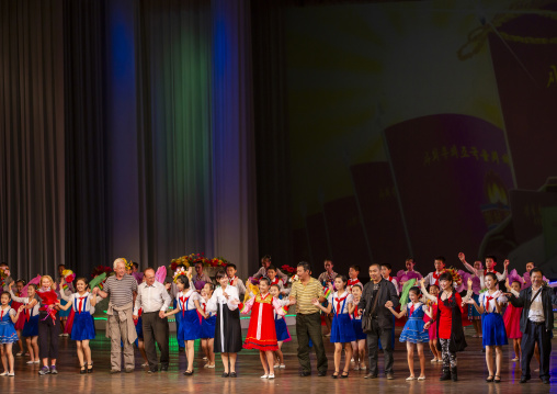 Young artists with tourists in Mangyongdae children's palace, DGC, Pyongyang, North Korea
