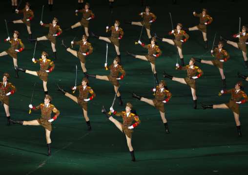 North Korean women dressed as soldiers dancing with swords in Arirang, DGC, Pyongyang, North Korea