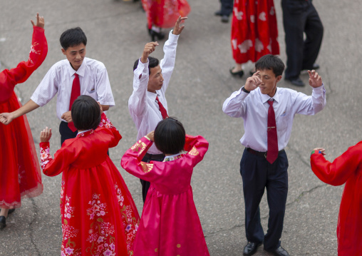 Students dancing on day of the foundation of the republic, DGC, Pyongyang, North Korea