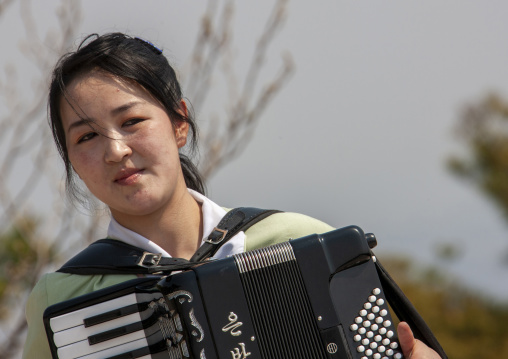 North Korean woman playing accordion, DGC, Pyongyang, North Korea