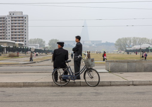 North Korean men with a bicycle in the street, DGC, Pyongyang, North Korea