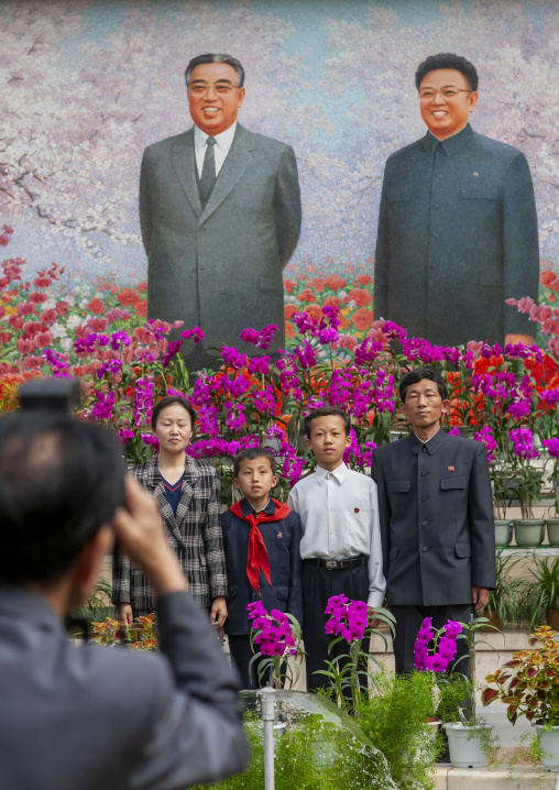 North Korean people posing in Kimilsungia and Kimjongilia festival, DGC, Pyongyang, North Korea