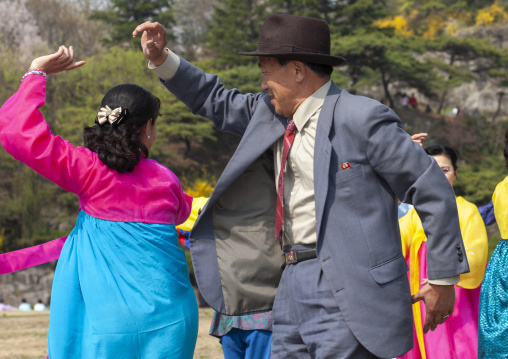 People dancing in a park for the day of the sunP, DGC, Pyongyang, North Korea