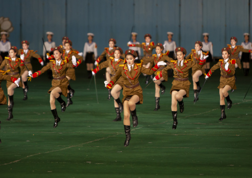 Women dressed as soldiers dancing with swords during Arirang, DGC, Pyongyang, North Korea