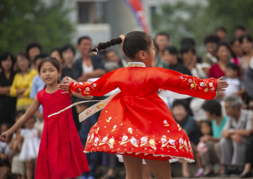 North Korean young girls dancing in traditional choson-ot on national day, DGC, Pyongyang, North Korea