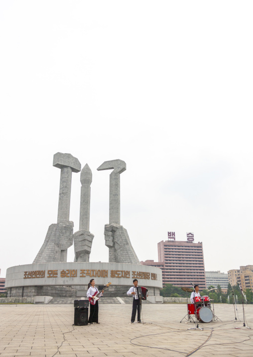 State artists on national day in front of the monument to the founding of the Party, DGC, Pyongyang, North Korea