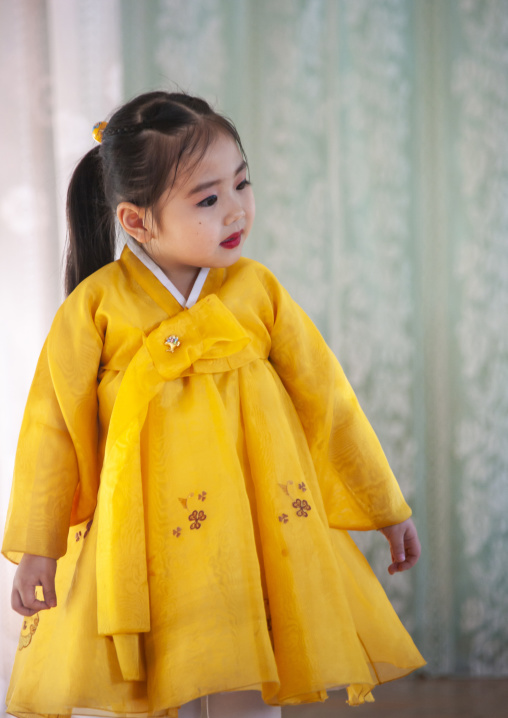 North Korean little girl in yellow choson-ot, North Hamgyong, Chongjin, North Korea
