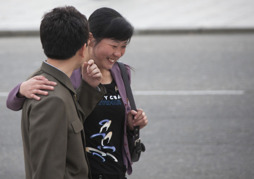 North Korean couple laughing in the street, DGC, Pyongyang, North Korea