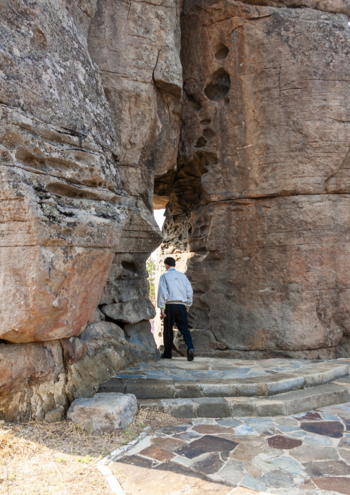 North Korean guide in the famous wedding rock, North Hamgyong, Chilbosan, North Korea