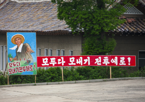 Propaganda billboard in a village, South Pyongan, Chongsan-ri Cooperative Farm, North Korea