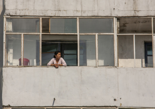 North Korean woman on the balcony of her apartement, DGC, Pyongyang, North Korea