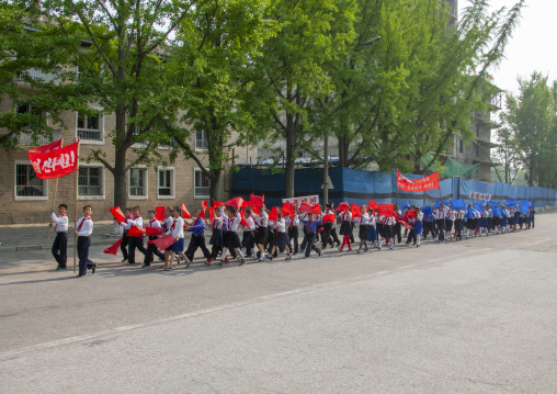 Young North Korean pioneers parade in the street, North Hwanghae, Kaesong, North Korea