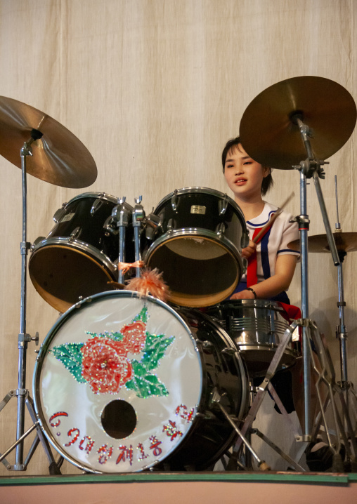 North Korean pioneer girl playing drums, DGC, Pyongyang, North Korea