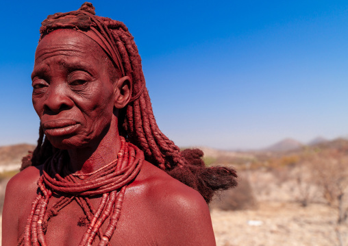 Portrait of a Himba tribe woman covered with otjize, Cunene Province, Oncocua, Angola