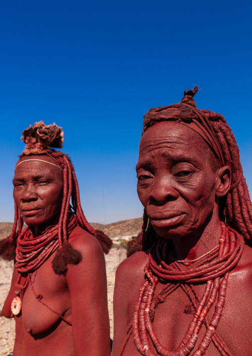 Himba tribe women covered with otjize, Cunene Province, Oncocua, Angola