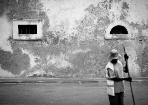 Man With Hat Raking Up, Benguela, Angola