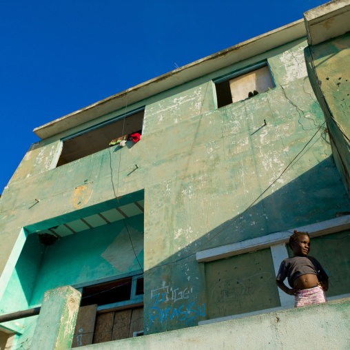 Yooung Girl In Front Of A Former Army Base That Became A Squat, Lobito, Angola