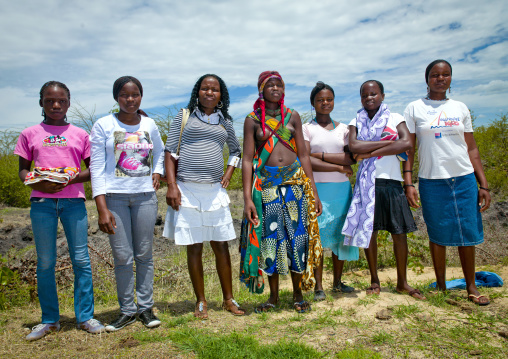 Mugambue Girl In Traditional Dress In The Middle Of Her Friends, Angola