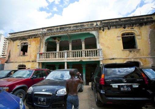 Expensive Cars Parked In Front Of The Ruins Of Grande Hotel, Luanda, Angola