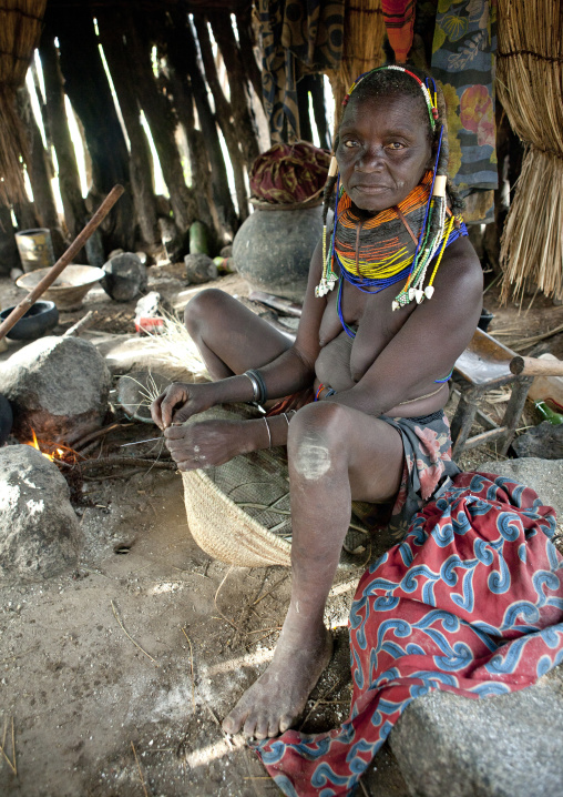 Old Mwila Woman Cooking In Her Hut, Chibia Area, Angola