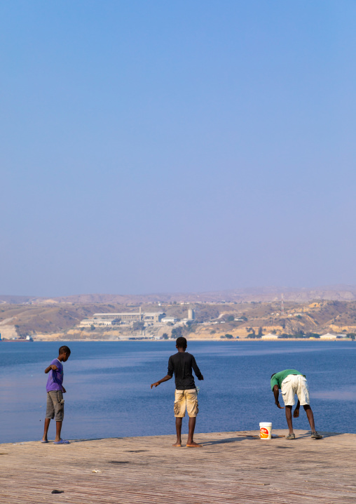 Men fishing on the jetty, Benguela Province, Lobito, Angola