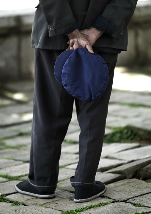 Man Holding A Blue Cap In His Back, Jianshui, Yunnan Province, China