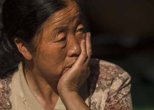 Woman With Head In Hand, Xizhou, Yunnan Province, China