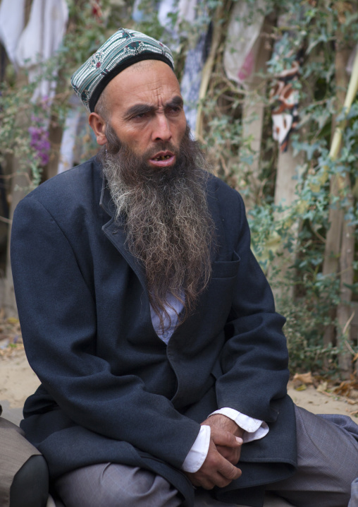 Uyghur Sufi Men Praying At Imam Asim Tomb In The Taklamakan Desert, Xinjiang Uyghur Autonomous Region, China