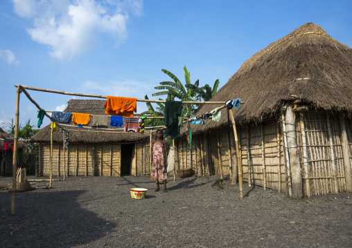 Benin, West Africa, Onigbolo Isaba, holi tribe woman taking care of washed clothes in front of her house