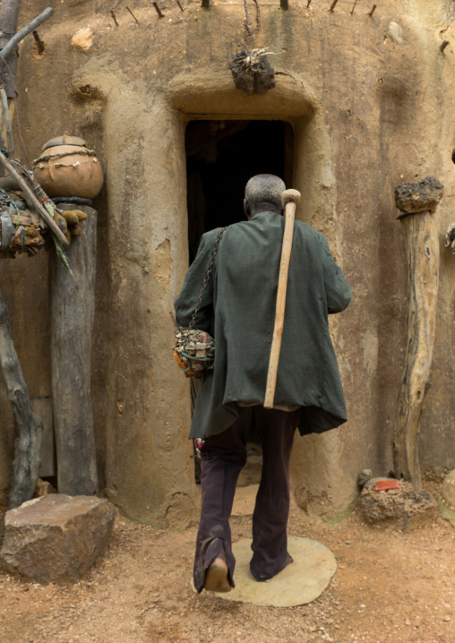 Benin, West Africa, Boukoumbé, mr kouagou maxon entering his traditional tata somba house