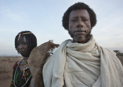 Karrayyu Tribe Man And His Daughter With Stranded Hair And Colourful Necklaces During Gadaaa Ceremony, Metahara, Ethiopia