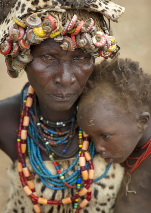 Senior Dassanech Woman Wearing Cheetah Skin And Baby Boy Omo Valley Ethiopia
