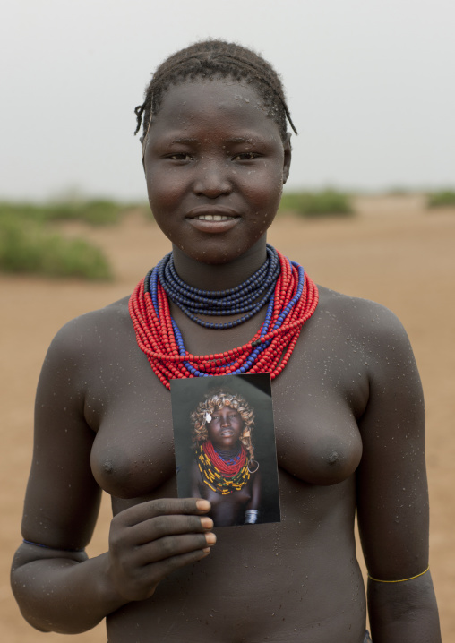 Young Dassanech Woman With Naked Breasts Showing A Picture Of Herself Omorate Ethiopia
