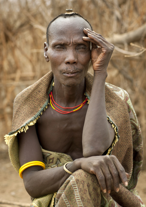 Portrait Of A Sitting Serene Dassanech Man With Hand On Face Omo Valley Ethiopia