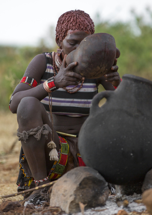 Bashada Tribe Woman Drinkinf Alcohol During A Bull Jumping Ceremony, Dimeka, Omo Valley, Ethiopia