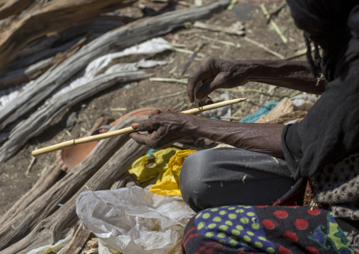 Woman Selling Stick To Make Curly Hair In Afar Tribe, Assayta, Ethiopia