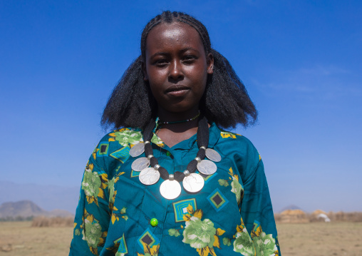 Portrait of an oromo woman with maria theresa thalers necklace, Amhara region, Artuma, Ethiopia
