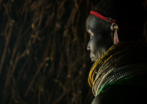 Nyangatom tribe woman with piles of beads, Omo valley, Kangate, Ethiopia