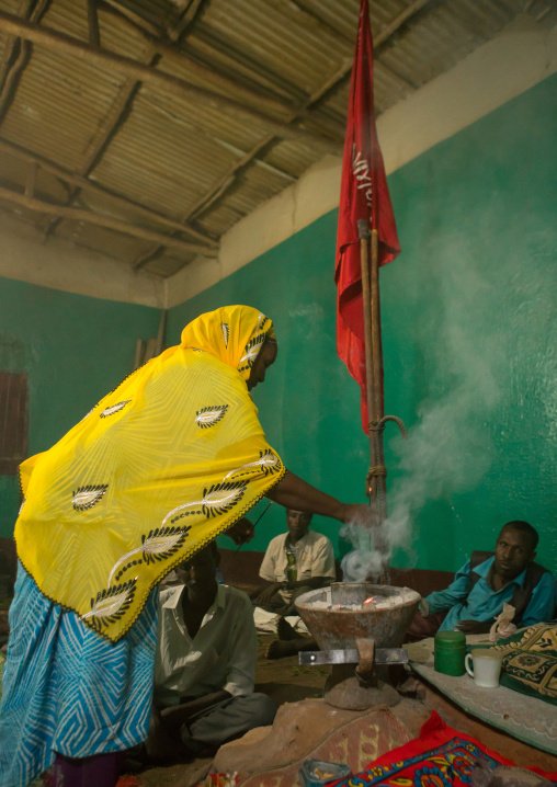 Woman burning insence during a sufi ceremony, Harari region, Harar, Ethiopia