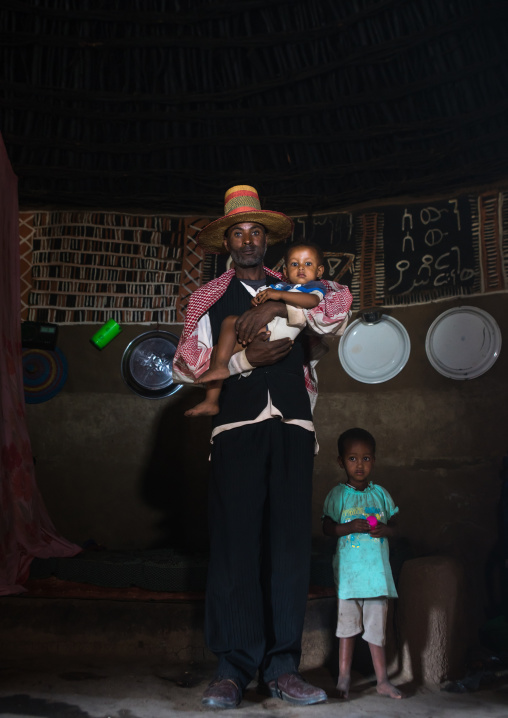 Ethiopia, Kembata, Alaba Kuito, ethiopian family inside a traditional painted and decorated house