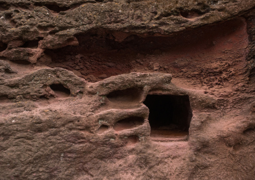 Niches for the monks in a monolithic rock-cut church, Amhara region, Lalibela, Ethiopia