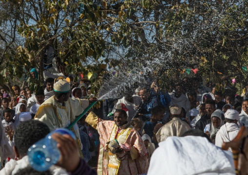 Holy water sprayed onto the crowd attending Timkat celebrations of epiphany, Amhara region, Lalibela, Ethiopia