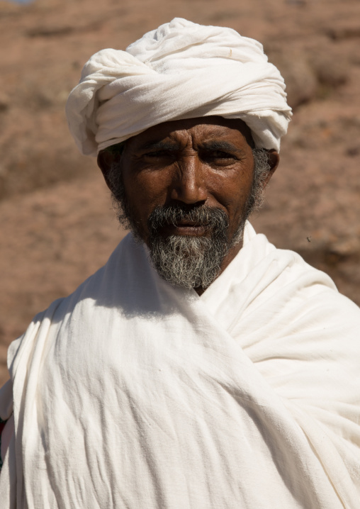 Portrait of a priest of the ethiopian orthodox church in white shawl, Amhara region, Lalibela, Ethiopia