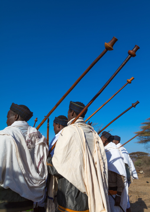 Borana tribe men with their ororo sticks during the Gada system ceremony, Oromia, Yabelo, Ethiopia